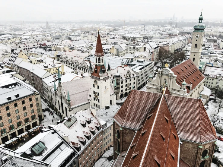 a city with tall buildings in the snow