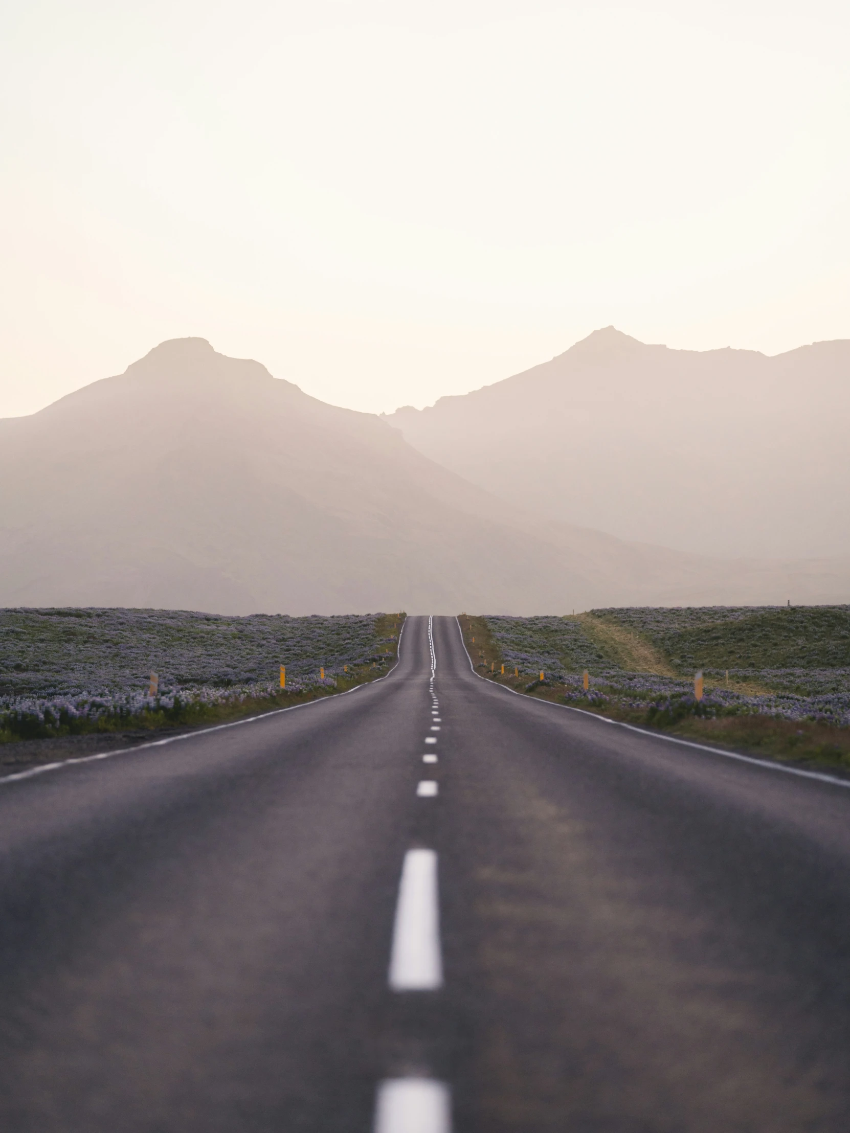 the straight paved road stretches out into the distance