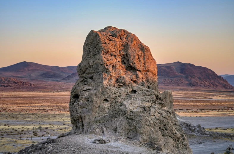 rock formations in a mountainous area with hills in the background