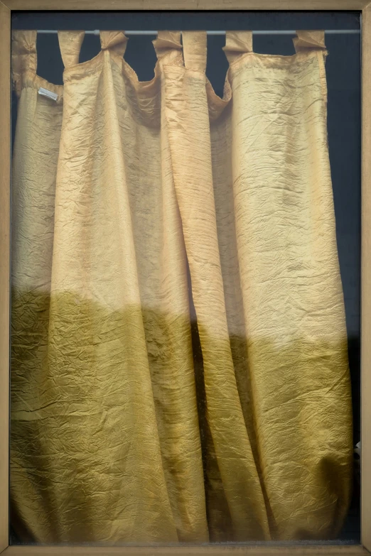 two curtains in front of an open window