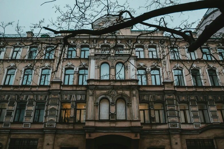 a large building with many windows and a clock on the front