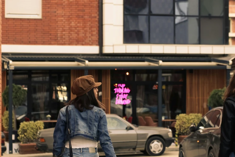 a woman standing on the street and looking around