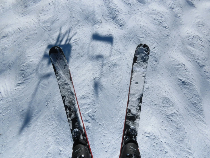 a person on skis on top of a snowy slope