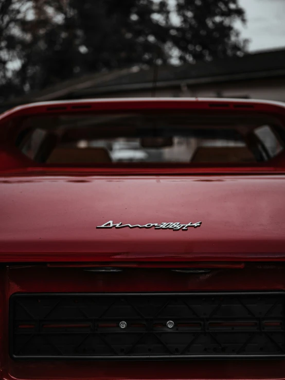 an older, red dodge parked on the street