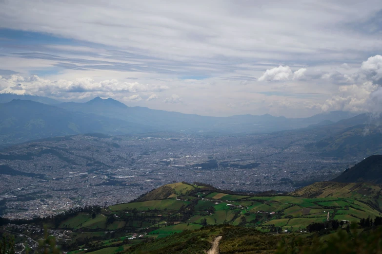 the view from a hill overlooking a valley below