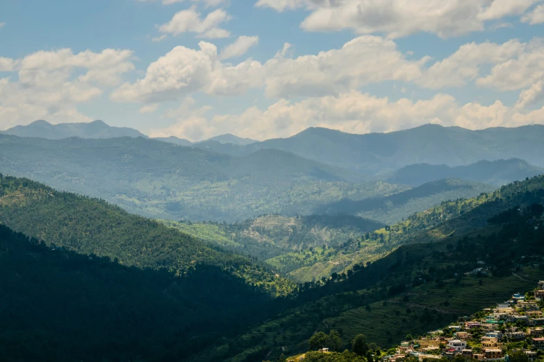 a mountain landscape with many hills in the distance