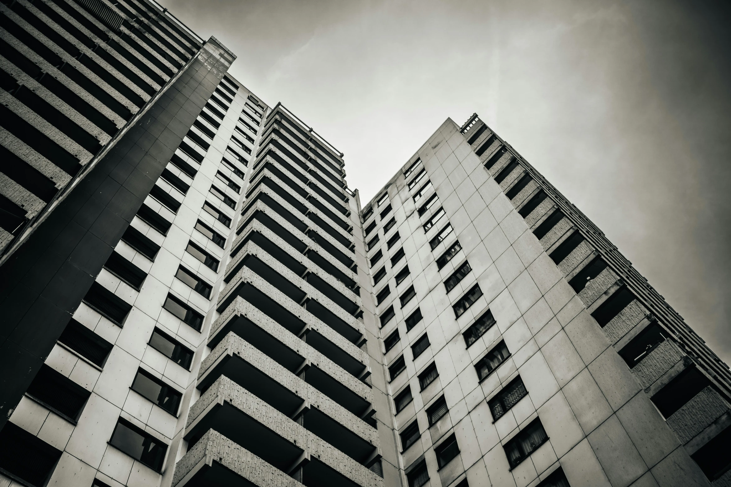 a couple of tall buildings towering over the city