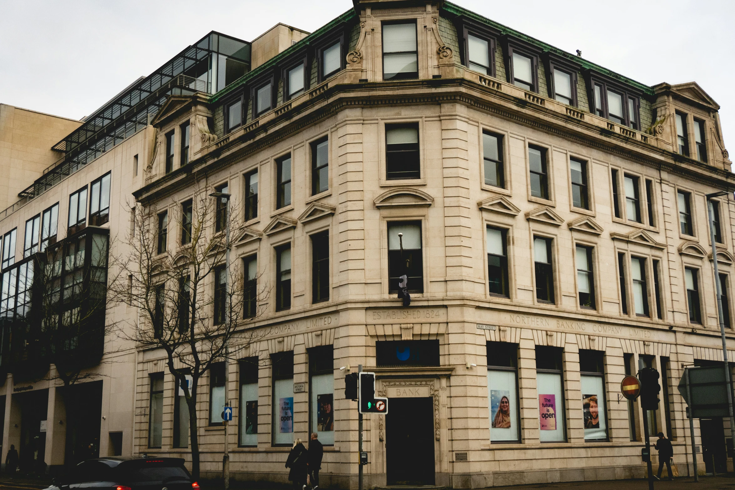 an old building sitting on the corner of a street