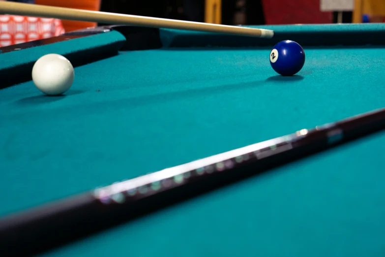 the billiard is about ready to strike a ball