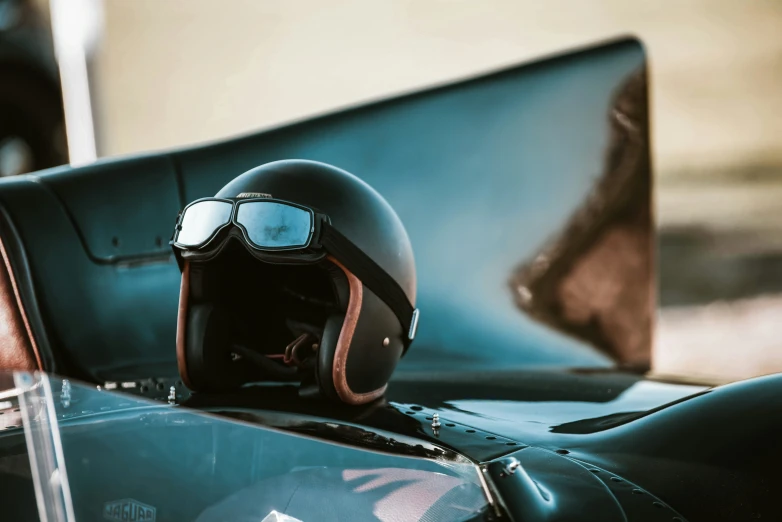 there is a helmet and goggles on a motorcycle