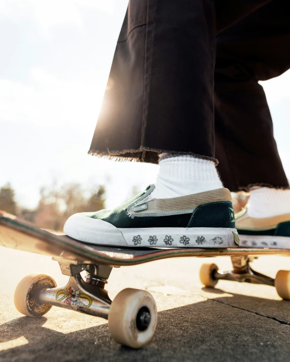 a person with white socks on is riding a skateboard