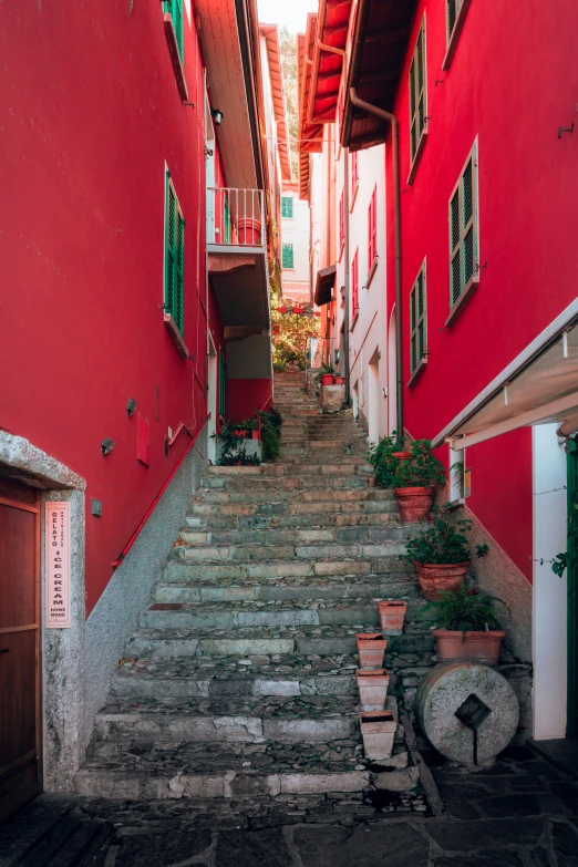 a stairway leading up to a red building