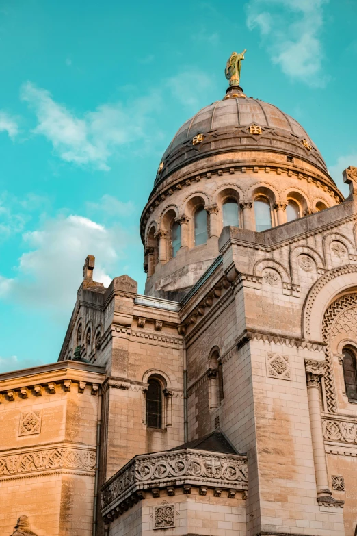 a tall building with a golden cupola atop it