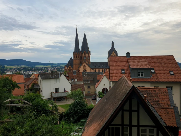 the roofs of buildings in a town with steeples