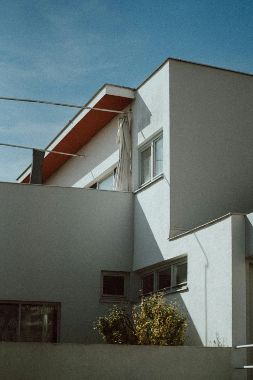 an apartment building with the front side of it in shadow