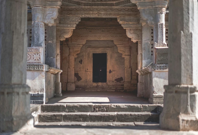 a large doorway that has some steps leading to it