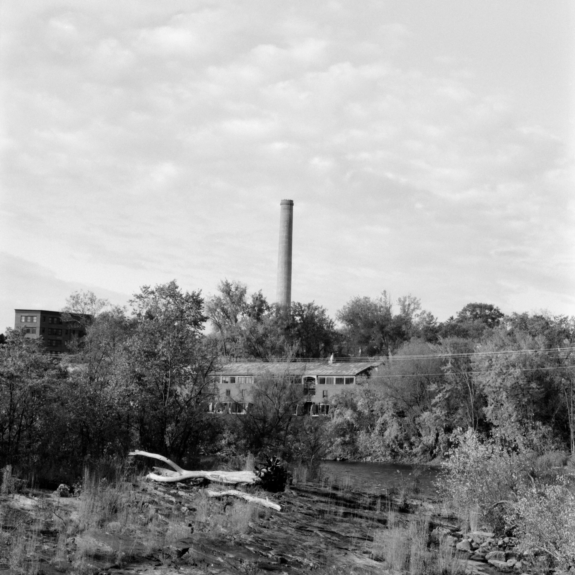 an old industrial power plant on the bank of the river