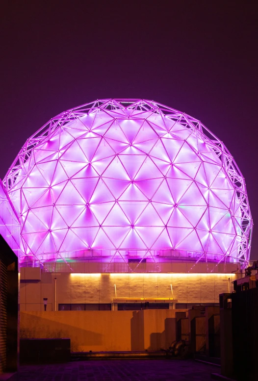 a large white ball with the lights lit up on it