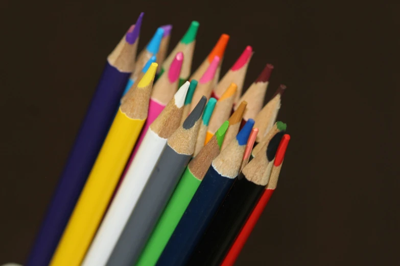 a close up of several different colored pencils