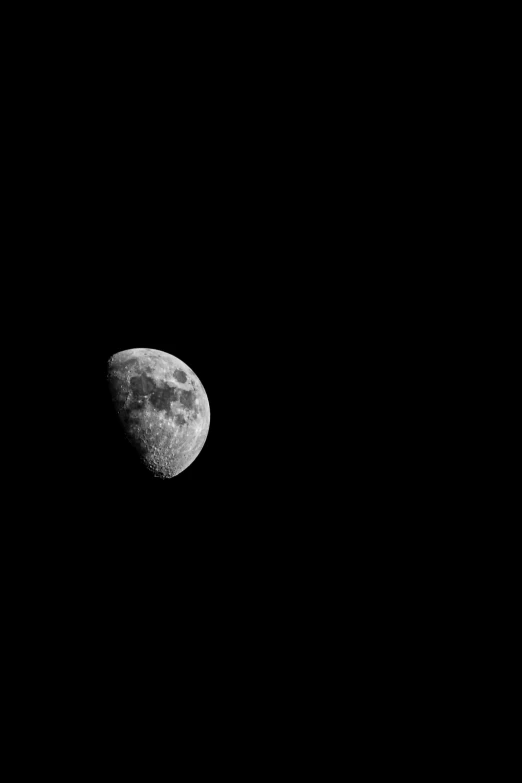 a full moon seen in the sky with no clouds