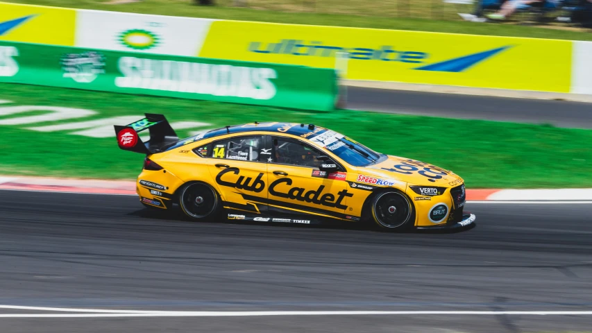 an event taking place on the track with a yellow car