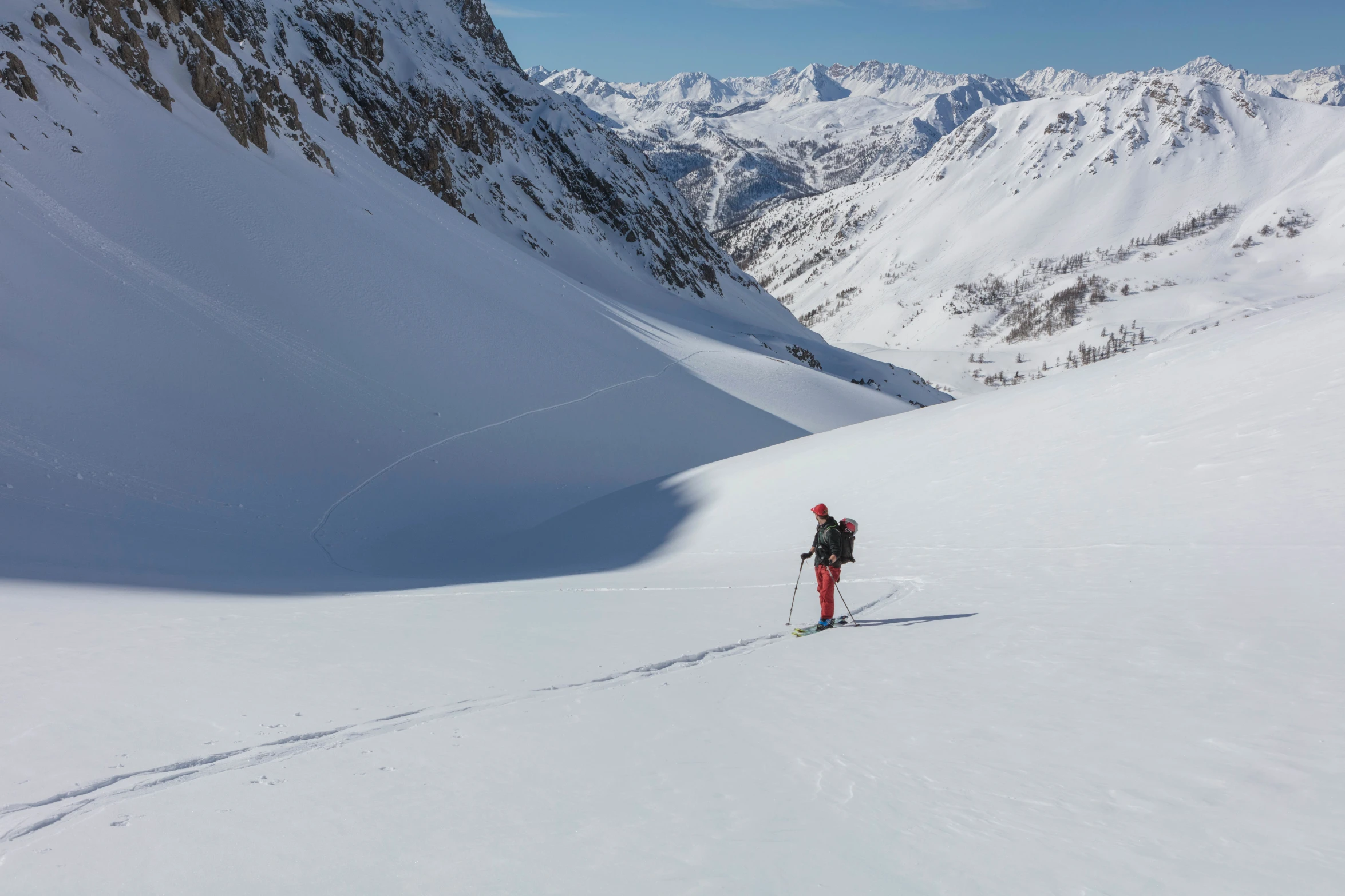 a person walking up a snowy slope