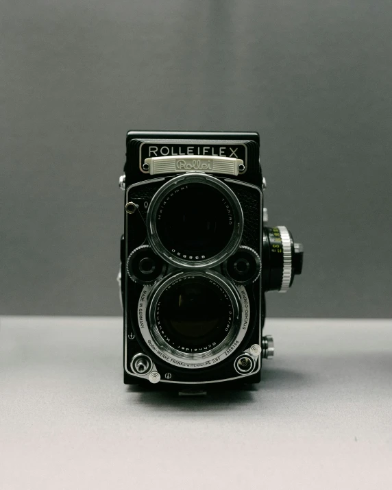 old time camera with lens opened on table