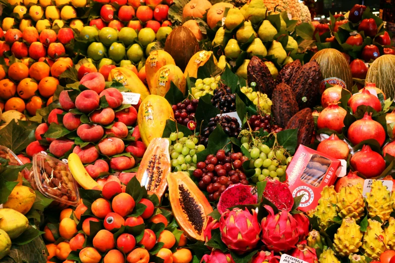 many different kinds of fruit are stacked up