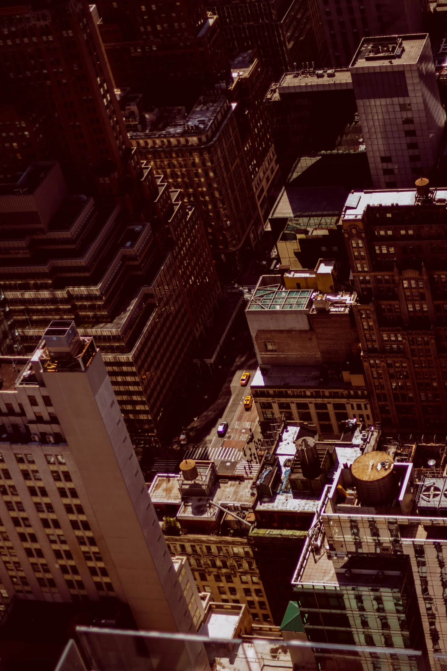 view from a high up of tall buildings with many windows