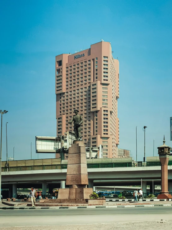 a very tall building towering over a city