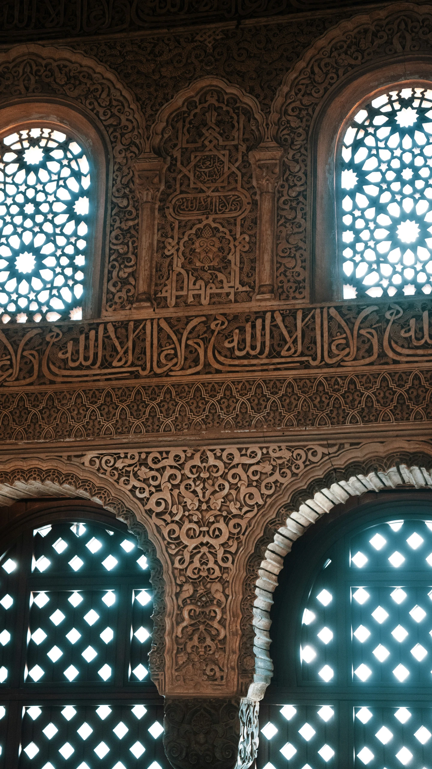 the intricately decorated wall and windows in an old building