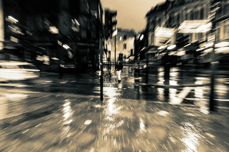 a black and white po of a city street at night