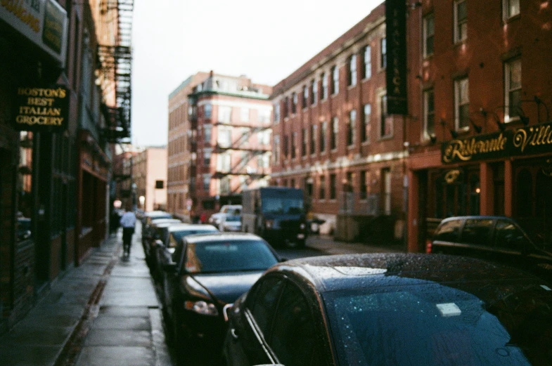 the streets are lined with cars on either side