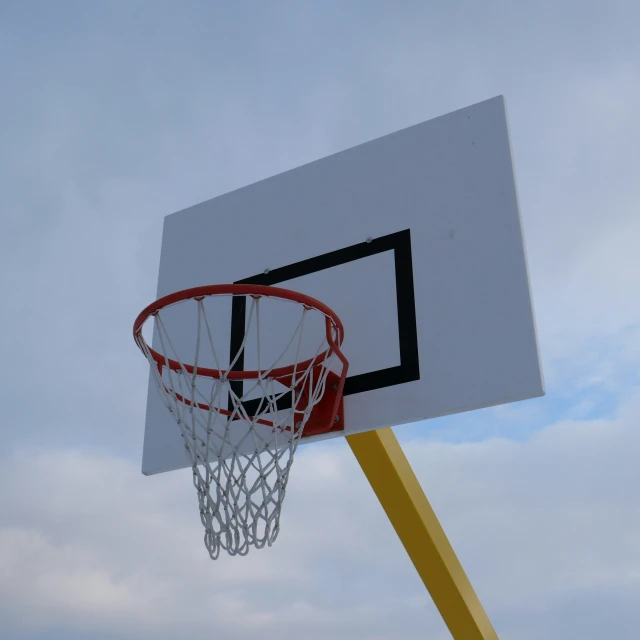 a basketball hoop with a basket hanging from it