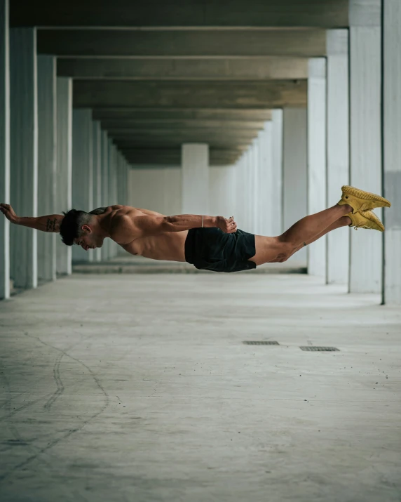 a man that is diving for a ball in the water