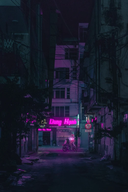 a dark street with buildings and neon signs