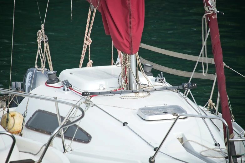 white sail boat in large open water during daytime