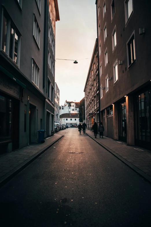 there is a very dark street between two buildings