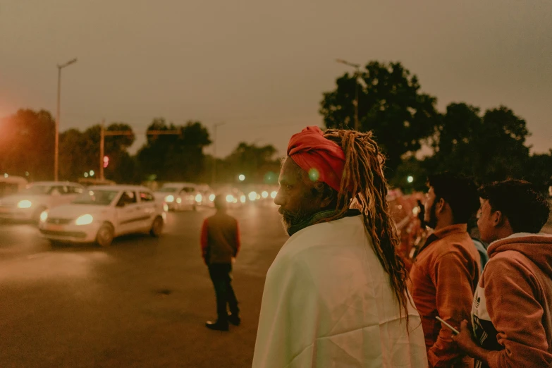 a man standing on the side of a street