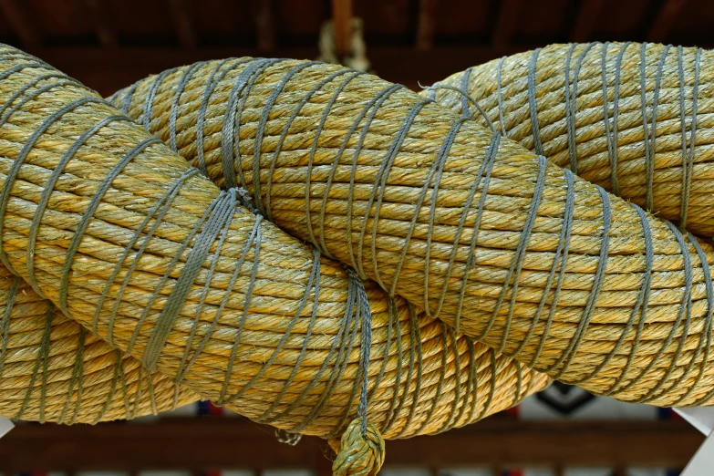 large balls of rope hanging on an outside building