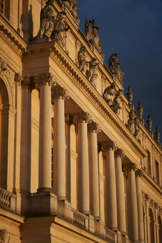 a large building with many statues on top