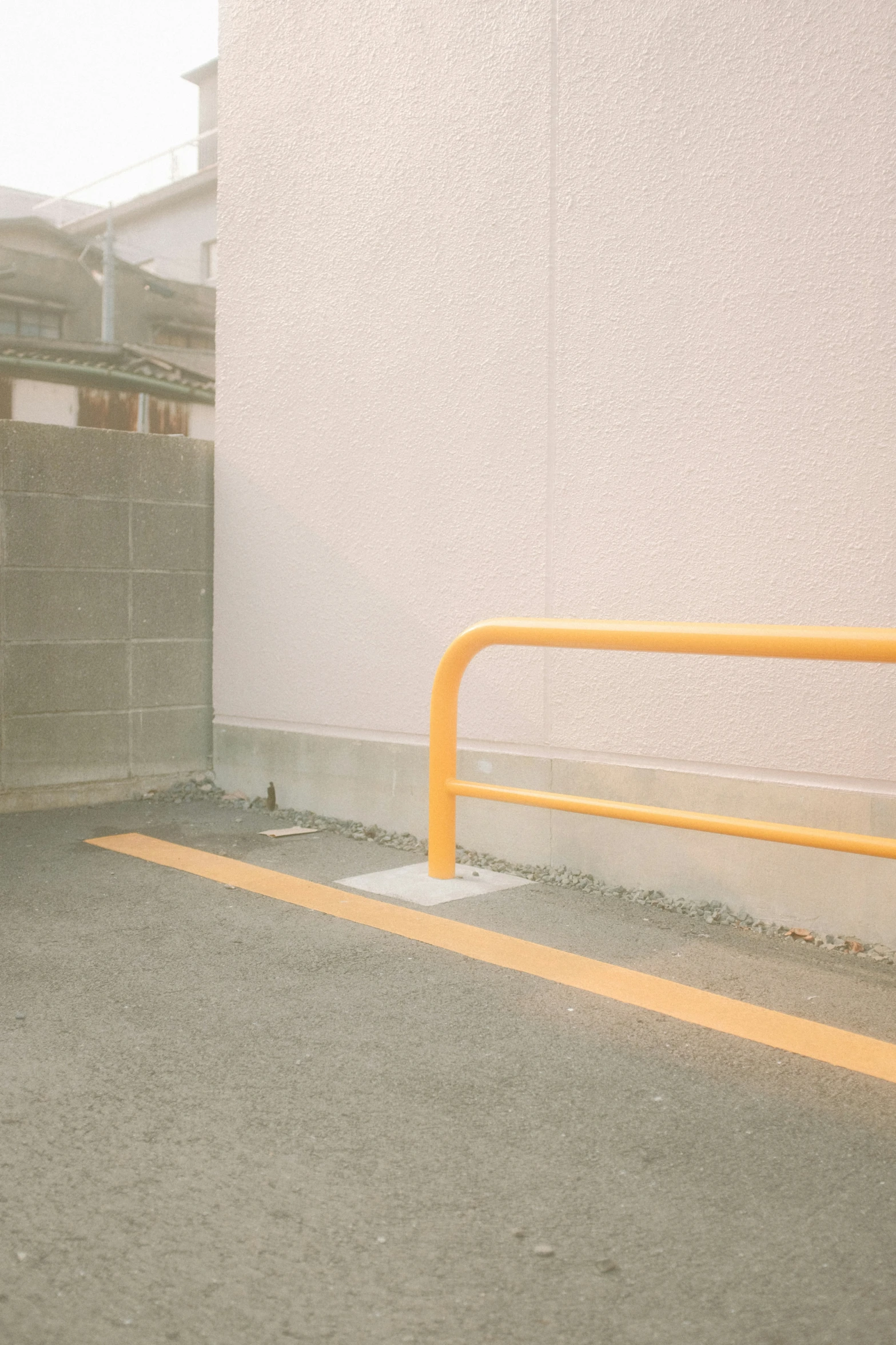 the door to an entry way is closed and the yellow railings have been painted yellow