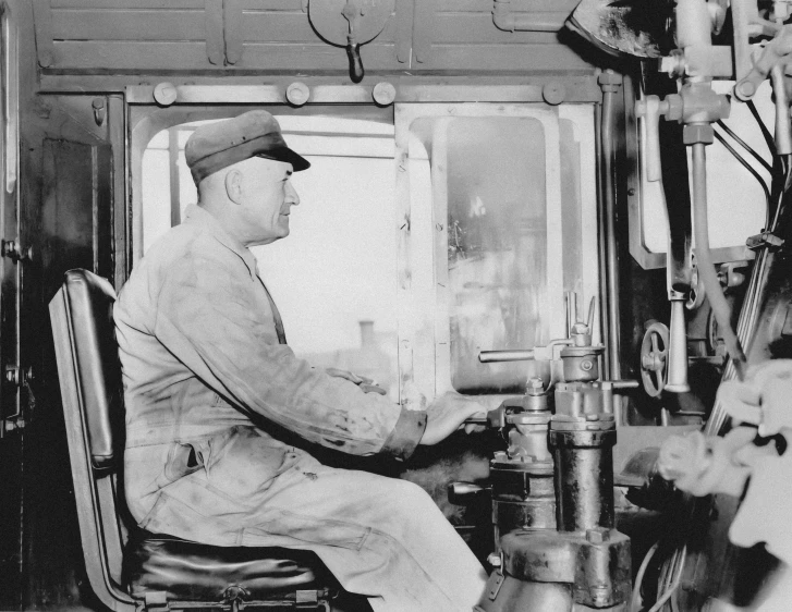 man working in an old time railroad station