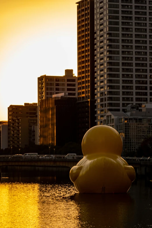 a statue is in the water of a city