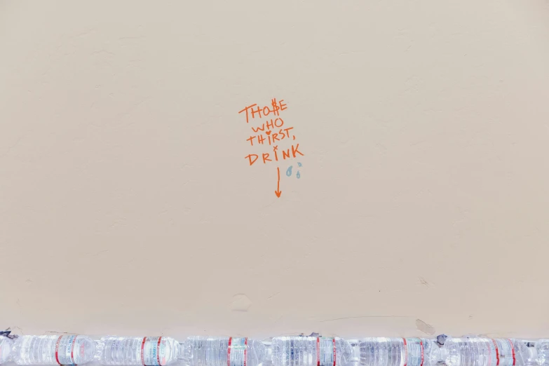 there is an orange marker drawn on a wall