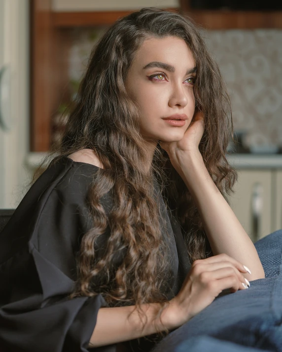 a beautiful woman with long hair wearing a black top