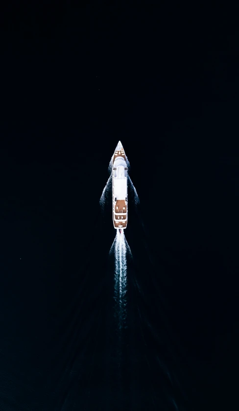 a boat floating on the water at night