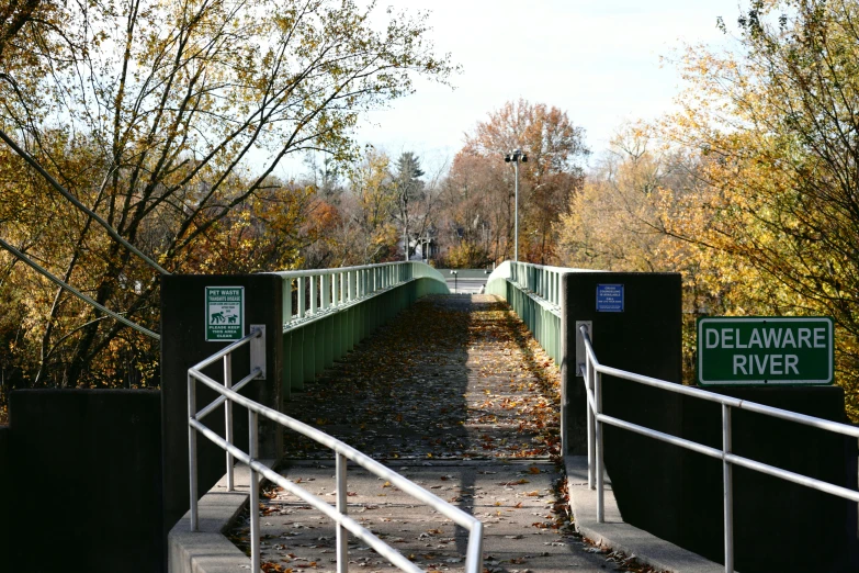 the walkway near the sidewalk sign leads towards the sewer