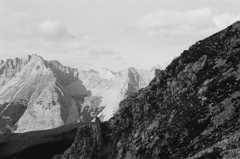 a black and white image of a mountain ridge