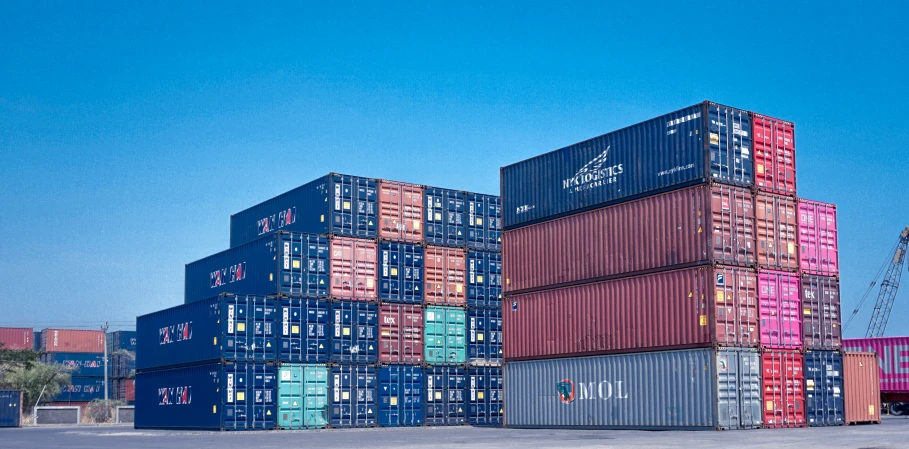 a group of cargo containers that are stacked up